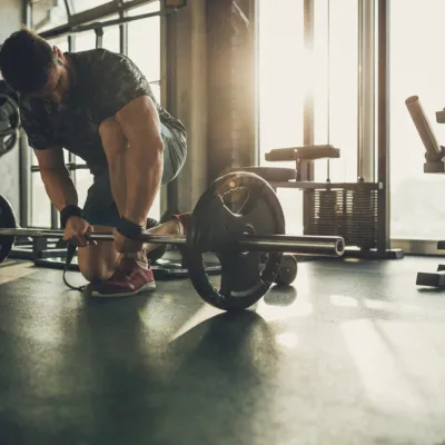 Determined Man Prepares To Lift Barbell In Gym 2026 03 09 21 44 03 Utc
