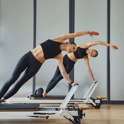 Two Women Exercising In A Pilates Studio 2026 03 24 03 22 11 Utc