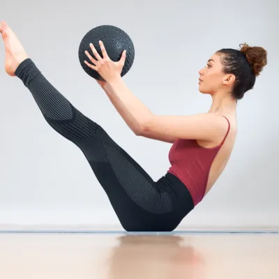 Woman Exercising Core Strength With Medicine Ball 2026 03 25 06 59 17 Utc