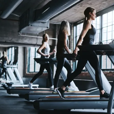 Woman Workout And Earphones In Gym With Treadmill 2026 05 07 20 18 08 Utc