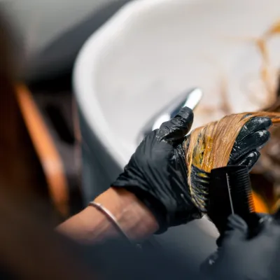 Close Up Of A Hairdresser Applying Paint To A Clie 2026 01 06 08 50 35 Utc