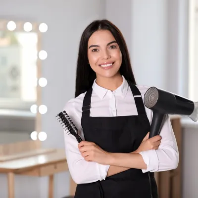 Happy Hairstylist Holding Hairbrush And Hairdryer 2026 03 27 01 25 49 Utc