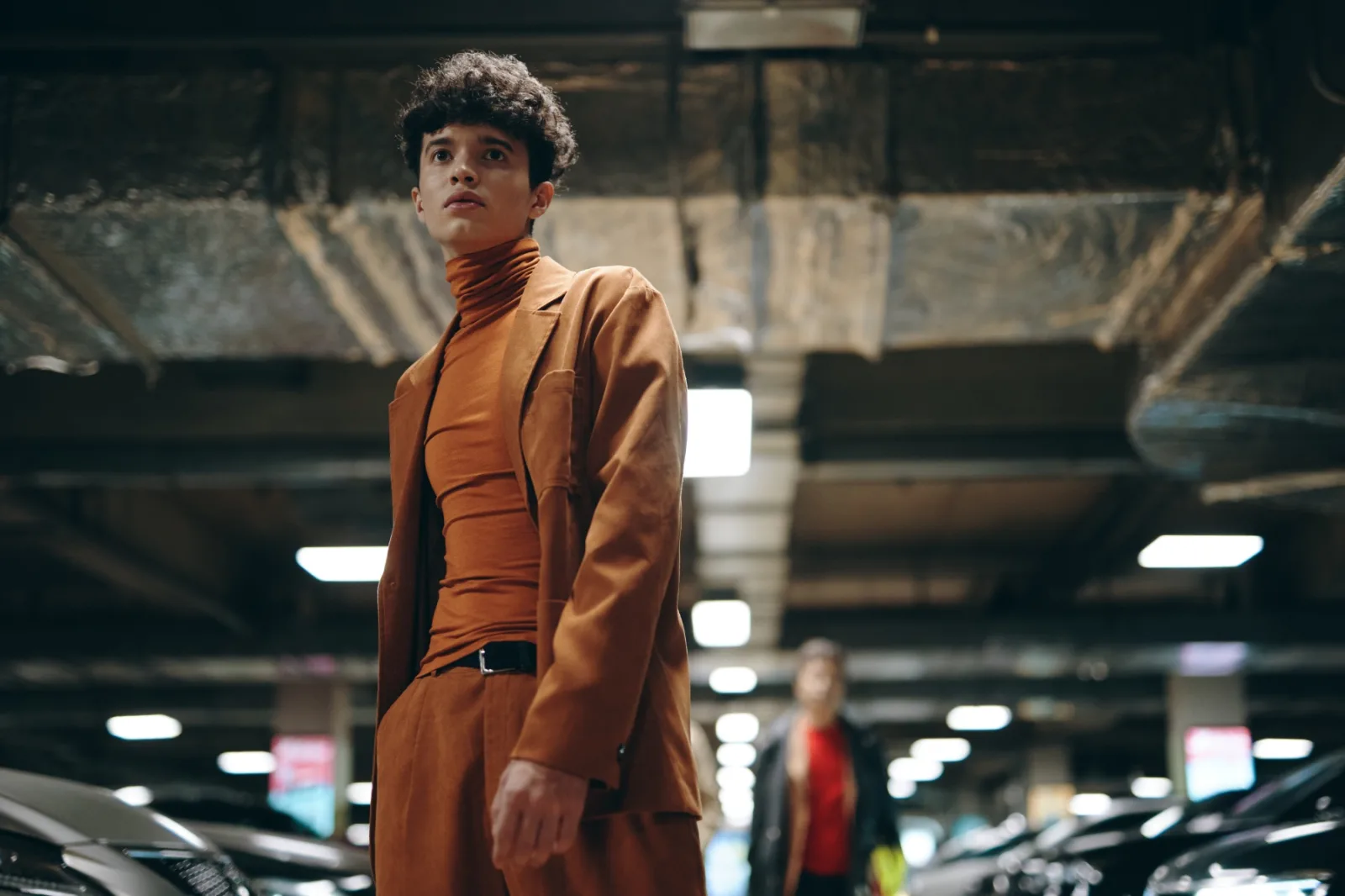 Stylish Young Man In An Orange Outfit Standing In 2026 03 24 06 17 36 Utc