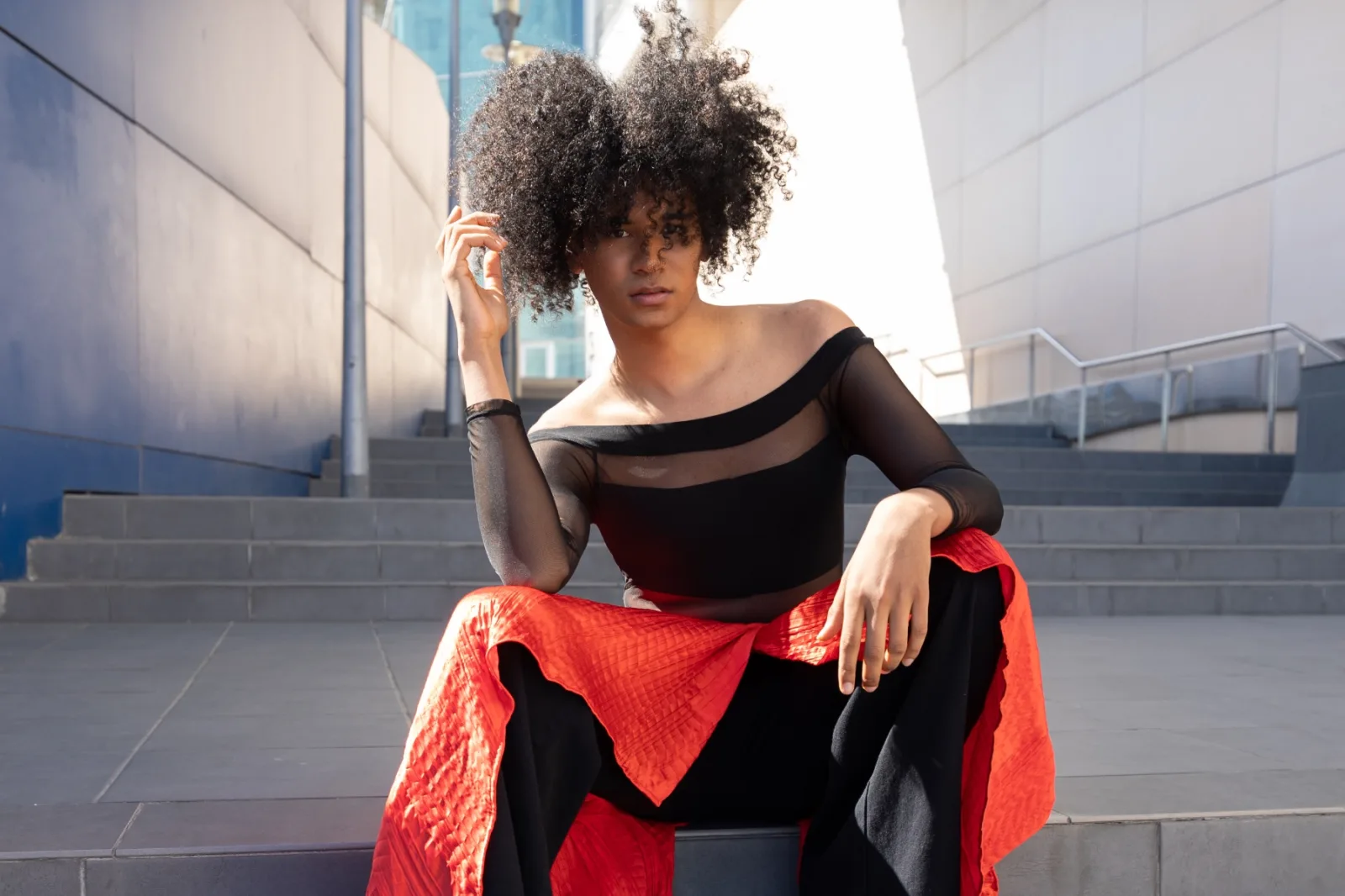 Model In Black Top And Red Dress On Steps 2026 03 16 06 19 51 Utc