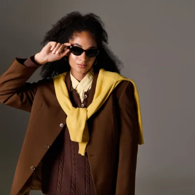 Stylish Woman In Brown Blazer And Sunglasses Posin 2026 03 25 09 34 36 Utc