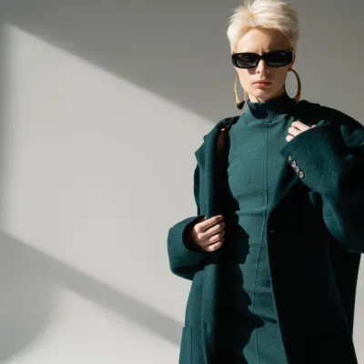 Young Woman In Trendy Sunglasses Standing In Green 2026 01 09 12 35 49 Utc
