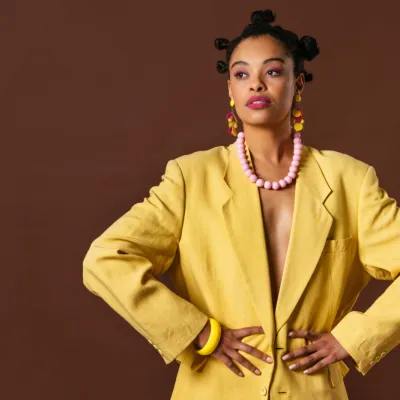 Stylish Woman In Yellow Blazer Poses With Confiden 2026 03 24 06 20 05 Utc